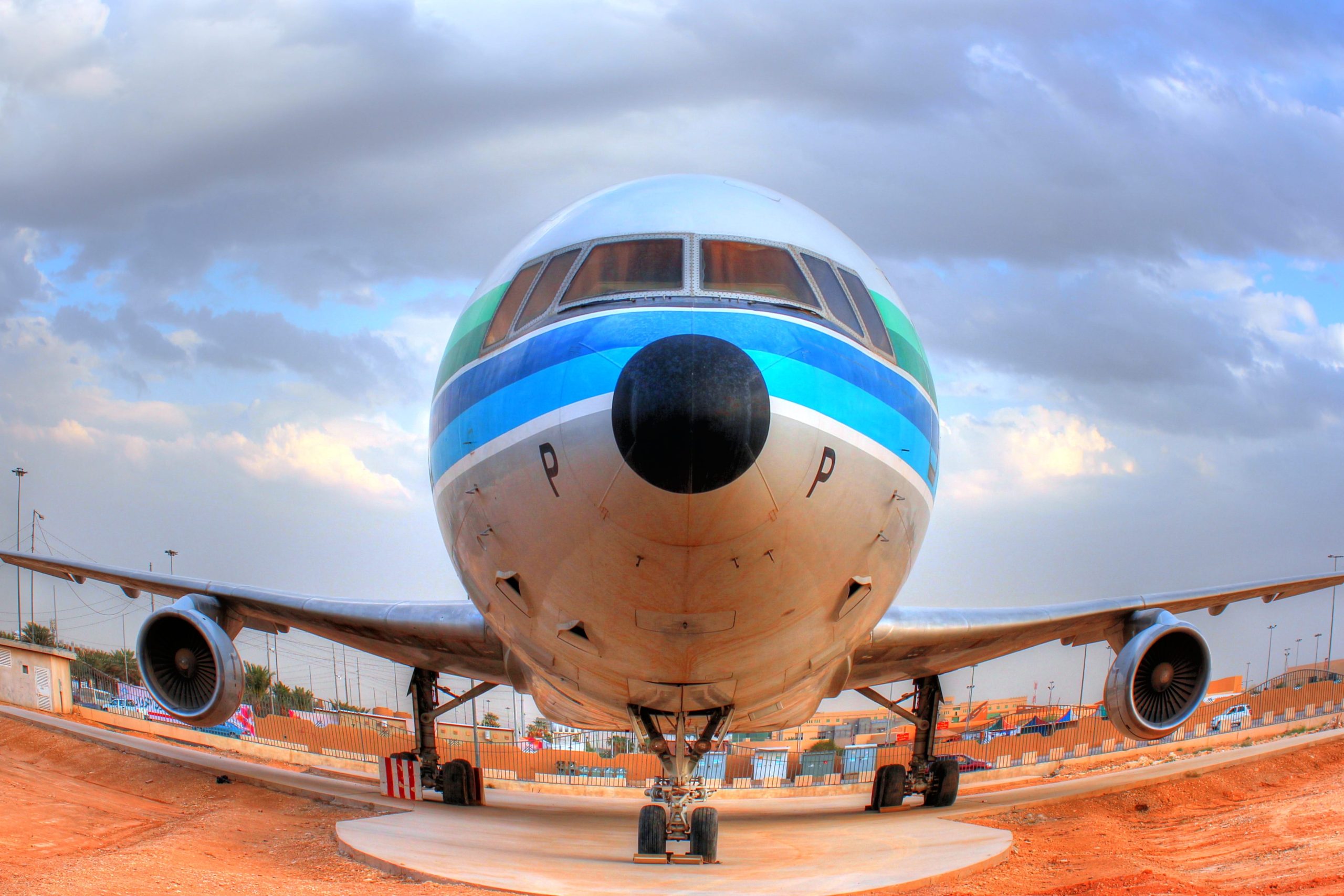 Book flights preview for Ghana travel tools with airplane at airport