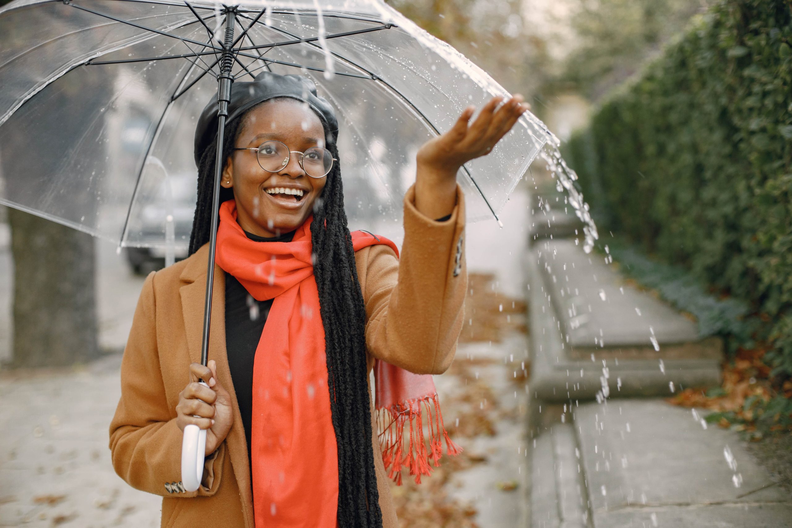 Weather forecast preview for Ghana travel tools with person under umbrella