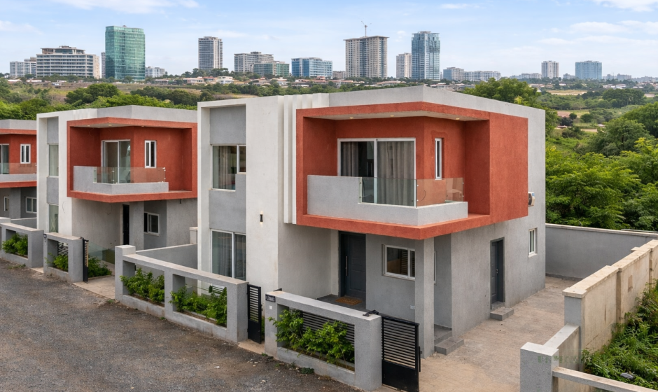 Modern townhouse development in Accra Ghana with contemporary architecture and city skyline