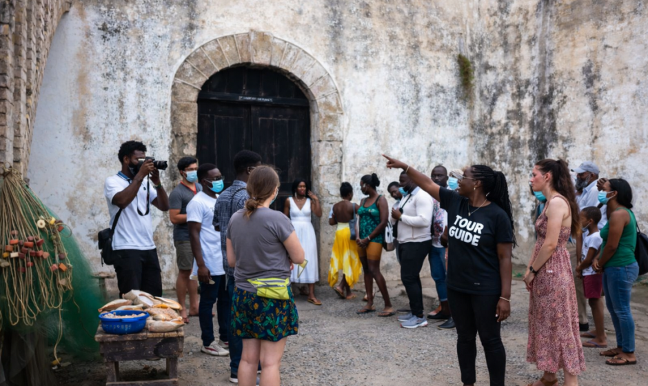 African American diaspora members visiting Ghana’s historic slave castles on the Atlantic coast, reflecting on ancestral connections to West Africa.