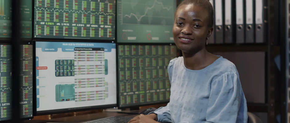Nigerian stock investor sitting at a terminal