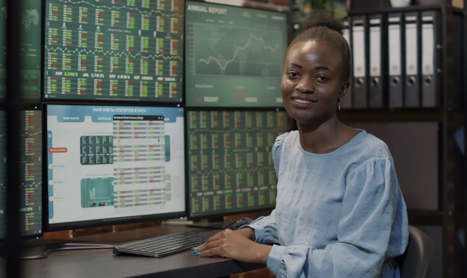 Nigerian stock investor sitting at a terminal