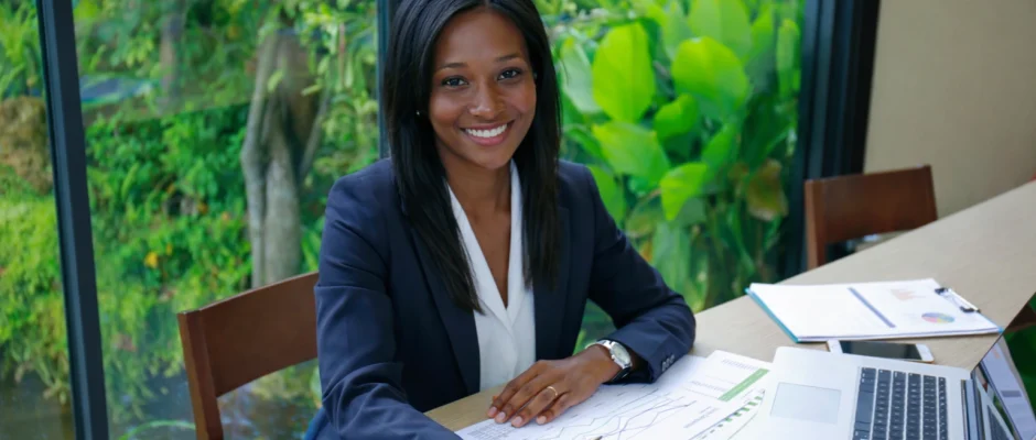 Black businesswoman reviewing tax documents in an office for Americans living in Ghana