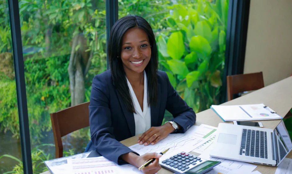 Black businesswoman reviewing tax documents in an office for Americans living in Ghana
