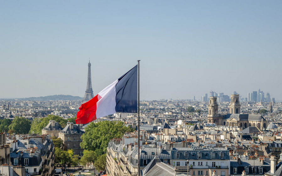 French flag over Paris skyline representing African countries divesting from France and changing ties in 2026