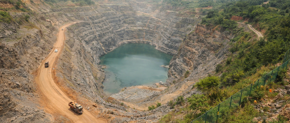 amang Mine in Ghana showing large open pit gold mining operation with terraced excavation roads