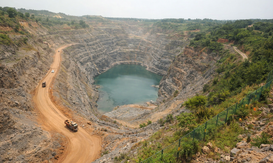 amang Mine in Ghana showing large open pit gold mining operation with terraced excavation roads