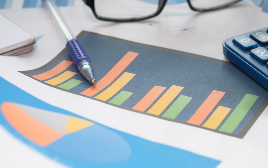 Ghana credit rating upgrade concept with financial chart calculator and investment analysis tools