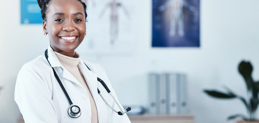 Ghanaian female doctor in white coat, ready to help with the new Ghana free primary health care programme