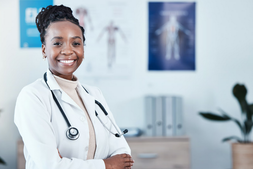 Ghanaian female doctor in white coat, ready to help with the new Ghana free primary health care programme