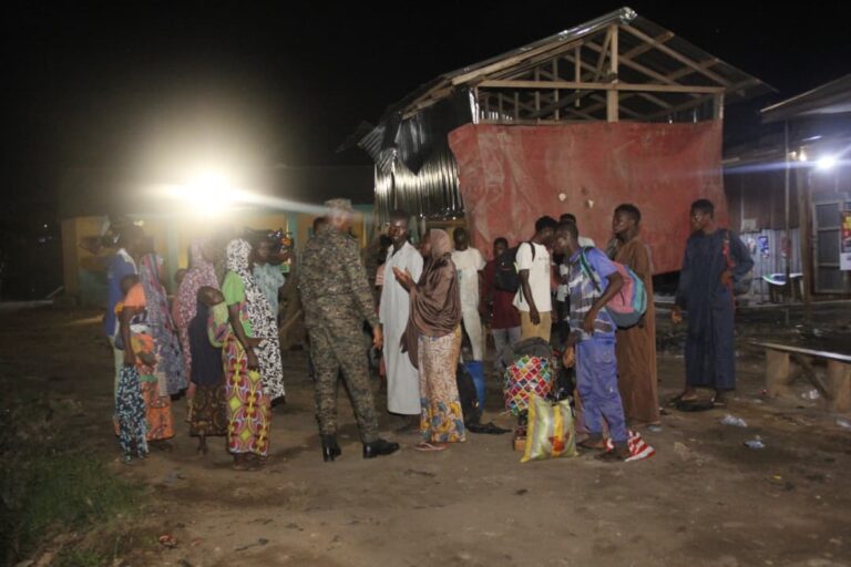 Kumasi immigration sweep operation in Ghana as officers question undocumented migrants during a nighttime enforcement raid in Kumasi.