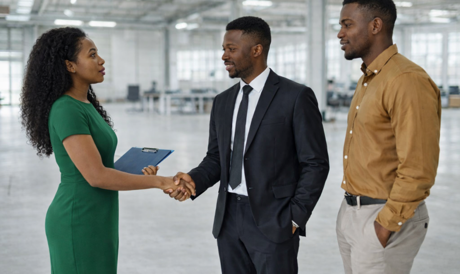 Business professionals discussing commercial property in Ghana office