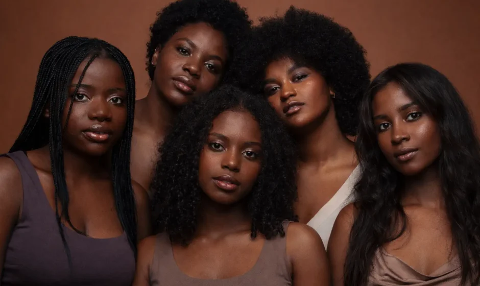 Black American women in Ghana smiling together in Accra during relocation journey