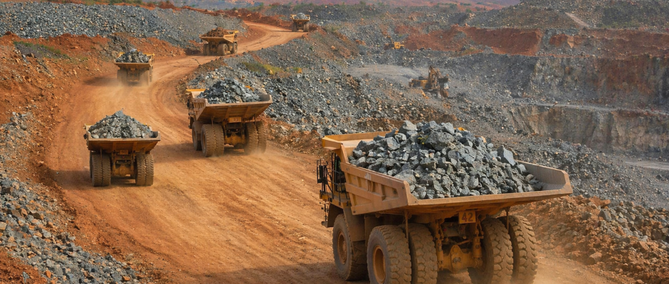 Mining trucks hauling rock at the Damang mine site in Ghana during the Damang mine takeover Ghana story
