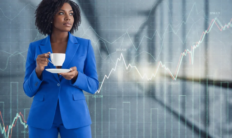 Professional Black Ghanaian woman in a blue business suit holding coffee with financial data charts representing AI investment growth in Ghana