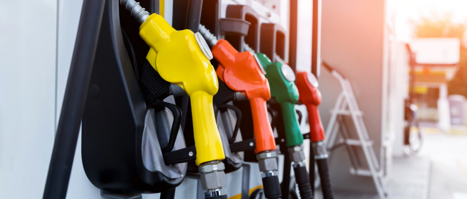 Multicolored gas pumps at a fuel station representing Ghana fuel price relief 2026 and changing fuel costs