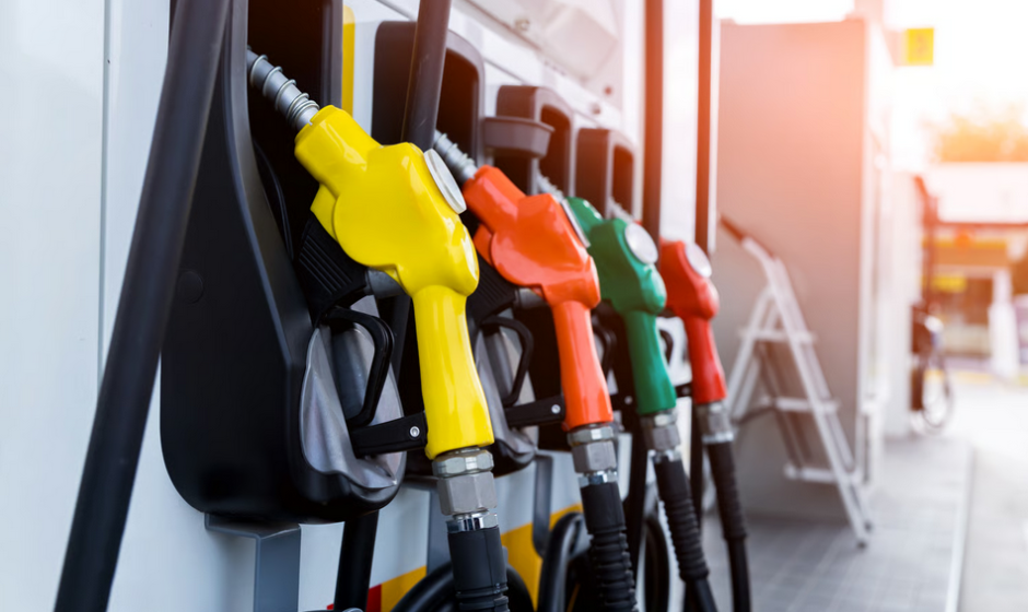 Multicolored gas pumps at a fuel station representing Ghana fuel price relief 2026 and changing fuel costs