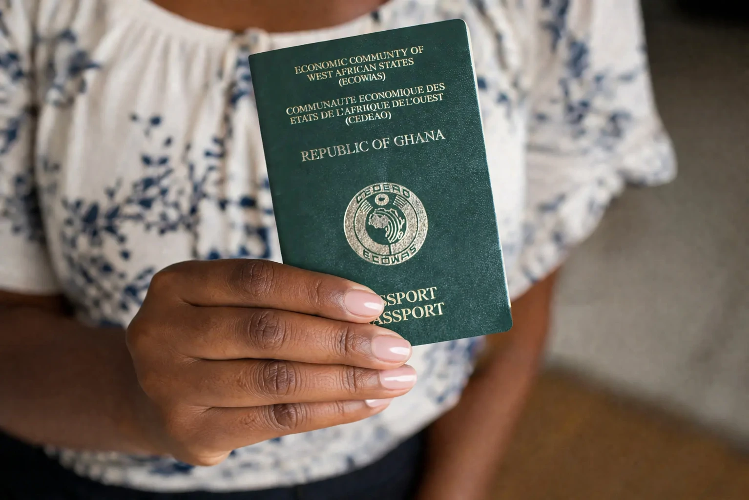 Ghana visa on arrival traveler holding Ghana passport at airport immigration