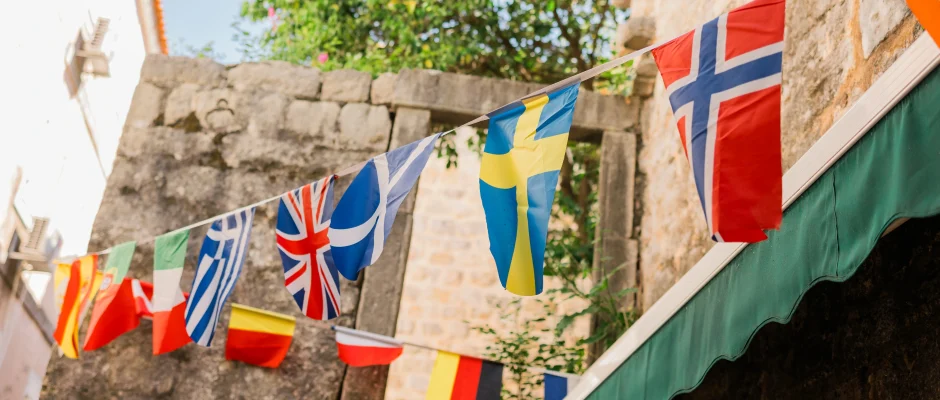 European flags in city street representing where Ghanaians live in Europe