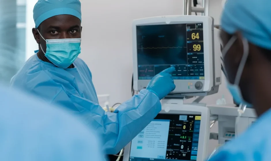 Ghanaian doctor pointing to medical imaging device in Accra hospital – visual context for Ghana medical equipment tax waivers