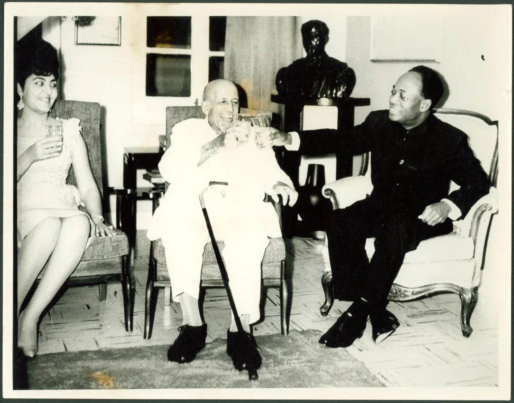 W. E. B. Du Bois at home on the evening of his 95th birthday toasting President Kwame Nkrumah and his wife, Fathia