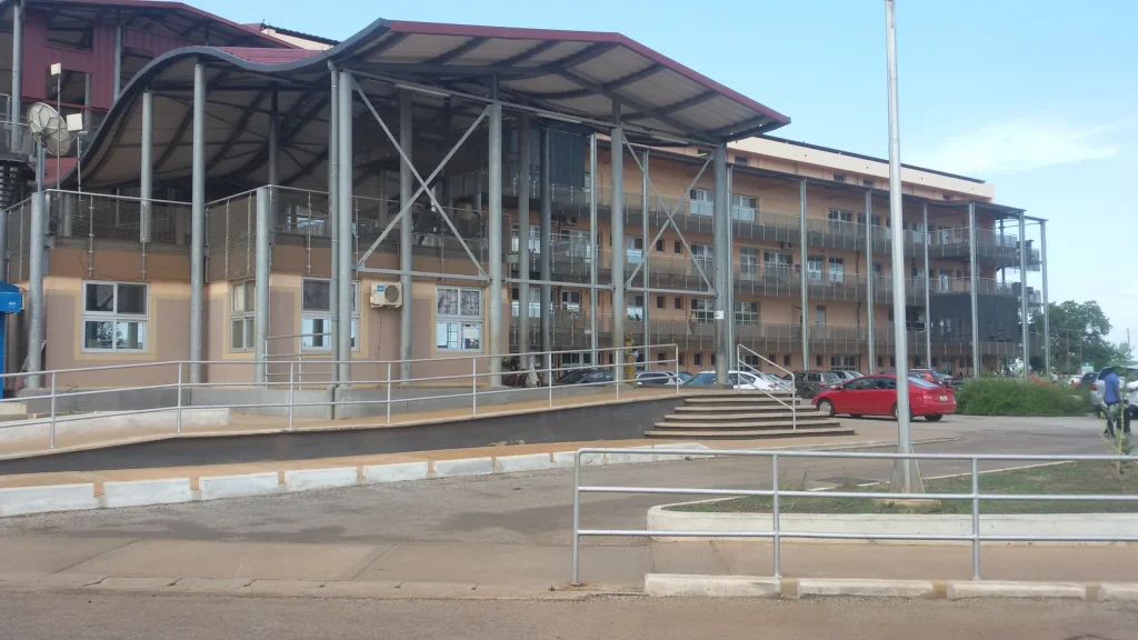 View of Tamale Teaching Hospital showing car park and new building